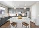 Modern kitchen showcasing a marble island, stainless steel appliances, and ample cabinet space at 4265 E Iliff Ave # 1, Denver, CO 80222