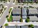 Aerial view of a two-story home featuring a well-maintained lawn and a detached two-car garage at 5799 Boston St, Denver, CO 80238
