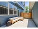 Inviting back patio with cozy seating and string lights, ideal for outdoor entertaining and relaxation at 5799 Boston St, Denver, CO 80238