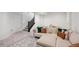 Inviting basement area with a comfortable sectional sofa, area rug, and neutral decor, perfect for relaxation at 5799 Boston St, Denver, CO 80238