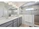 Beautiful bathroom with double sinks, vanity, and modern shower area, providing a spa-like experience at 5799 Boston St, Denver, CO 80238
