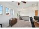 Upstairs loft area with desk, cabinet, and windows that provide natural light and great views at 5799 Boston St, Denver, CO 80238