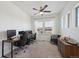Bright office space featuring two work stations, a ceiling fan, and plenty of natural light at 5799 Boston St, Denver, CO 80238