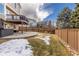 This backyard features a patio, hot tub, and wooden fence at 3001 White Oak Trl, Highlands Ranch, CO 80129