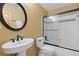 Bathroom with a toilet, shower, and sink with an oval mirror, providing a relaxing space at 3001 White Oak Trl, Highlands Ranch, CO 80129