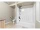 Bathroom featuring a shower-tub combo with a black shower head and neutral-colored walls at 3001 White Oak Trl, Highlands Ranch, CO 80129