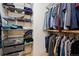 Organized closet with shelving and hanging rods offering ample storage space for clothes and accessories at 3001 White Oak Trl, Highlands Ranch, CO 80129