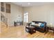 Inviting living area with hardwood floors, high ceilings, and a staircase features a comfortable seating area at 3001 White Oak Trl, Highlands Ranch, CO 80129