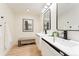 Elegant bathroom boasting dual sinks, modern faucets, and refined design elements at 1361 W Custer Pl, Denver, CO 80223