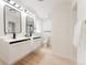 Modern bathroom featuring dual vanities, sleek fixtures, and a bright, spacious design at 1361 W Custer Pl, Denver, CO 80223