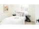 Comfortable bedroom with a serene ambiance, accentuated by stylish side tables and natural light at 1361 W Custer Pl, Denver, CO 80223