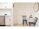Charming dining area with seating for two featuring a round table and modern decor at 1361 W Custer Pl, Denver, CO 80223