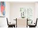 Cozy dining area with a table set for four, perfect for Gathering meals and entertaining guests at 1361 W Custer Pl, Denver, CO 80223