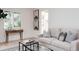 Inviting living room with a comfortable sofa, stylish decor, and plenty of natural light at 1361 W Custer Pl, Denver, CO 80223