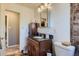 Bathroom with a granite vanity, and toilet with tile flooring at 7611 Fernando Rd, Denver, CO 80221