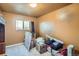 An unfurnished bedroom with moving boxes, neutral carpet, and one window at 7611 Fernando Rd, Denver, CO 80221