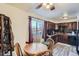 Cozy dining area with wood table, chairs, and a view from the window at 7611 Fernando Rd, Denver, CO 80221