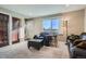 Living room featuring a cozy seating area, natural light, and a neutral color palette at 7611 Fernando Rd, Denver, CO 80221