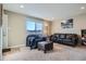 Living room featuring a comfortable seating area, natural light, and a calming atmosphere at 7611 Fernando Rd, Denver, CO 80221