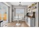 Bright dining area featuring a coffee bar, light fixture, and sliding glass doors to the patio at 5010 Ox Trl, Parker, CO 80134