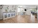Open-concept living space with hardwood floors, a dining area, and stylish decor at 5010 Ox Trl, Parker, CO 80134