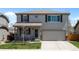 Charming two-story home featuring a well-manicured lawn and a two-car garage in a desirable neighborhood at 5010 Ox Trl, Parker, CO 80134