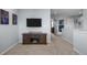 Cozy loft area with a tv and neutral carpet at 5010 Ox Trl, Parker, CO 80134