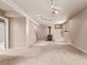 Basement featuring carpet flooring, neutral paint, and a wood burning stove at 3735 S Lewiston St, Aurora, CO 80013