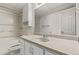 Well-lit bathroom features a bathtub with shower, toilet, vanity with countertop, and mirrored cabinet at 3735 S Lewiston St, Aurora, CO 80013