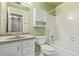 Bathroom featuring a vanity, mirror, storage, and tiled bathtub-shower combo at 3735 S Lewiston St, Aurora, CO 80013