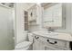 Bathroom featuring antique vanity, toilet and shower at 3735 S Lewiston St, Aurora, CO 80013