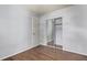 Bright bedroom with wood floors and a mirrored closet for ample storage space at 3735 S Lewiston St, Aurora, CO 80013