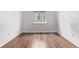 Spacious bedroom featuring wood floors, light walls, and plenty of sunlight from the window at 3735 S Lewiston St, Aurora, CO 80013