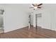 Bright and airy bedroom features wood flooring and closet with shelving at 3735 S Lewiston St, Aurora, CO 80013