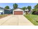 Charming single-story home featuring a large garage, well-maintained lawn, and colorful flower beds at 3735 S Lewiston St, Aurora, CO 80013