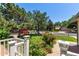 Inviting front yard with lush landscaping and a charming white picket fence at 3735 S Lewiston St, Aurora, CO 80013