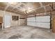 Spacious garage with a two-car door and plenty of storage space for tools and equipment at 3735 S Lewiston St, Aurora, CO 80013