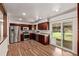 Updated kitchen boasts stainless steel appliances, granite countertops, and sliding door to the backyard at 3735 S Lewiston St, Aurora, CO 80013