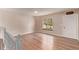 Bright living room with hardwood floors and a large window with a view to the front yard at 3735 S Lewiston St, Aurora, CO 80013