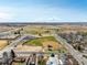 Aerial view of a sports complex with baseball field, park, and residential area in the background at 6707 6Th St, Frederick, CO 80530