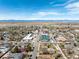 Aerial view of downtown neighborhood with mountain views, streets, and local businesses at 6707 6Th St, Frederick, CO 80530