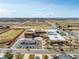 School aerial view featuring sports fields, parking, multiple buildings, and well maintained grounds at 6707 6Th St, Frederick, CO 80530