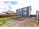 A two-story home is complemented by a grassy backyard and rock landscaping at 6707 6Th St, Frederick, CO 80530