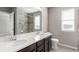 Bright bathroom with double sink vanity and modern fixtures at 6707 6Th St, Frederick, CO 80530