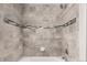 Tile shower with gray accent tiles and chrome hardware at 6707 6Th St, Frederick, CO 80530