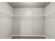Spacious walk-in closet with ample shelving for organization at 6707 6Th St, Frederick, CO 80530