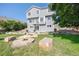 Backyard area including a fire pit and well-maintained lawn at 6833 E 115Th Ave, Thornton, CO 80233