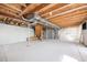 Spacious unfinished basement ready for customization, with exposed ceiling and utilities at 6833 E 115Th Ave, Thornton, CO 80233