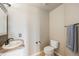 Powder room featuring tile flooring, single sink vanity, and standard toilet at 6833 E 115Th Ave, Thornton, CO 80233