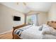 Cozy bedroom includes vaulted ceiling, wood floor, nice window and a ceiling fan at 6833 E 115Th Ave, Thornton, CO 80233